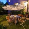 imageFREE SOLDIER 10FT Patio Offset Umbrella with 32 LED Lights Solar LED Cantilever Umbrella With Crank and Cross Base Outdoor Hanging Market Patio Umbrella for Garden Yard Deck PoolBeige